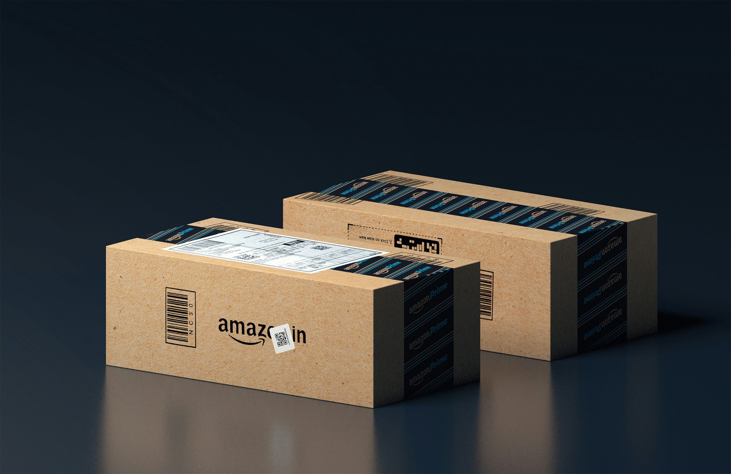 Two Amazon packages against a black backdrop.