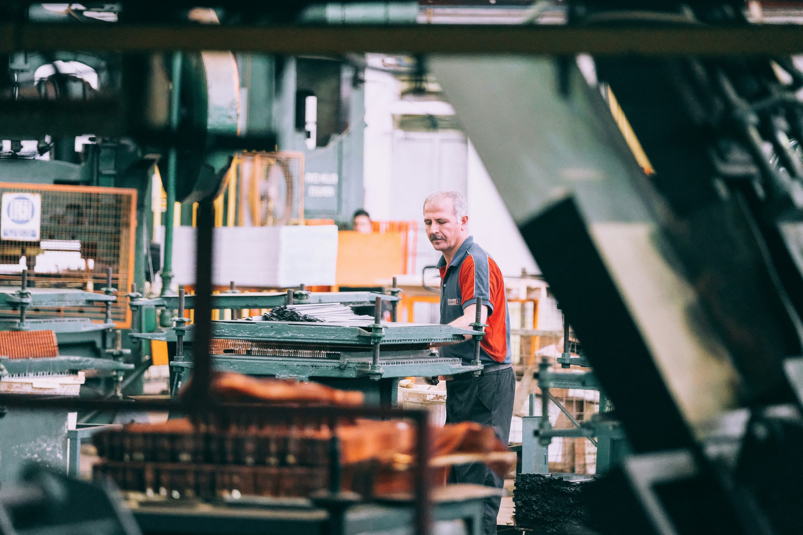 A manufacturing operative working in a factory.