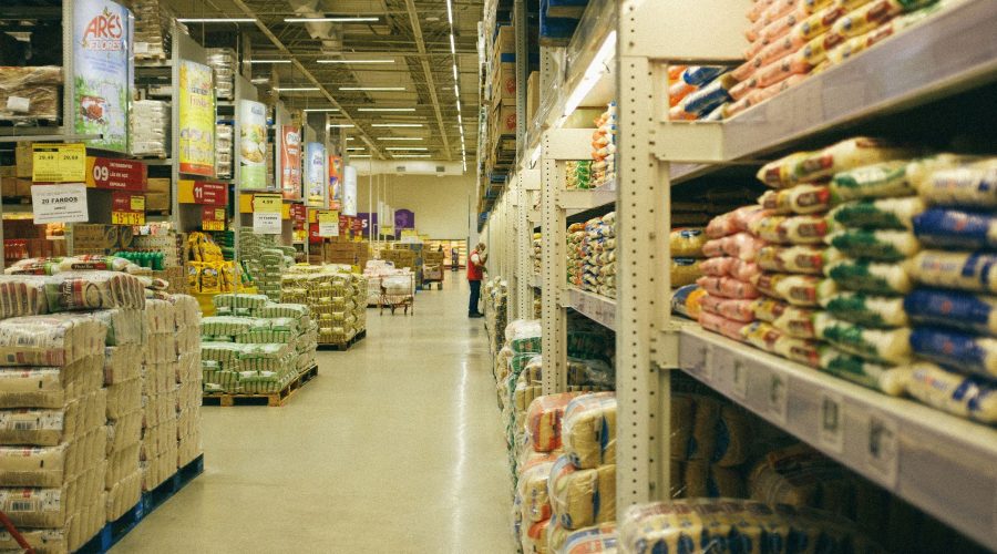 A warehouse with packages lined on shelves.